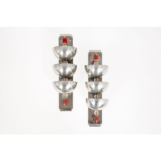 This incredible pair of antique Art Deco silver wall sconce lights are circa 1940. The sconce lamps feature three large...