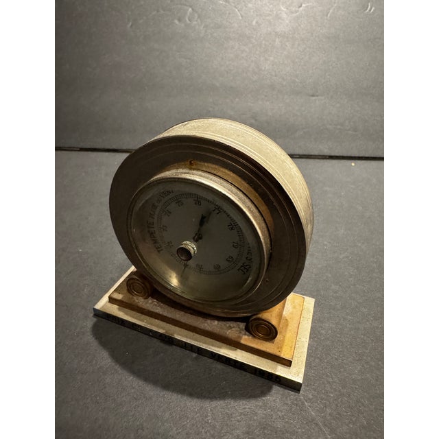 French Art Deco presentation barometer by Bancelin of Paris, dated 1935. This unusual interwar piece combines a functional...