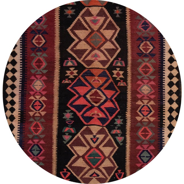 A beautiful hand-woven vintage Kilim runner with a red field, and multi-color accents an all-over geometric design. This...