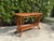 Crafted with exceptional attention to detail, this vintage handwoven natural rattan console table features an...