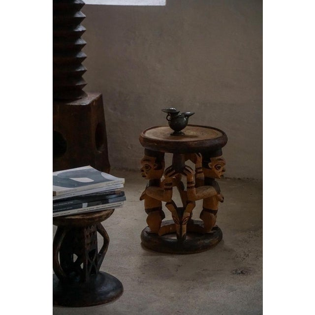 A remarkable example of African tribal art, this hand-carved hardwood stool is an authentic ethnographic object, crafted...