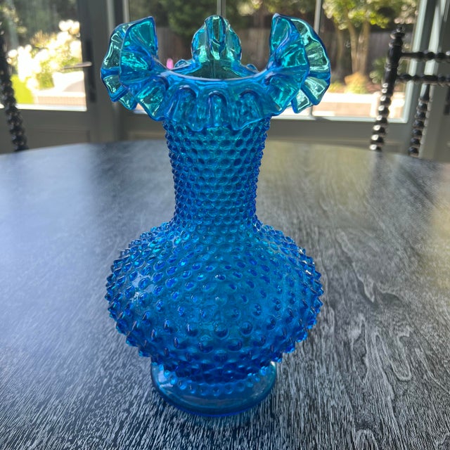 This stunning vintage Fenton vase from the 1960s features the timeless hobnail pattern with a ruffled top in rich Colonial...