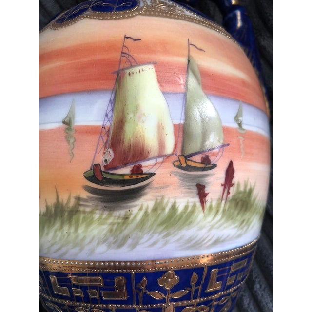 This beautiful vase was made in Japan in a European style. Exact age is unknown.