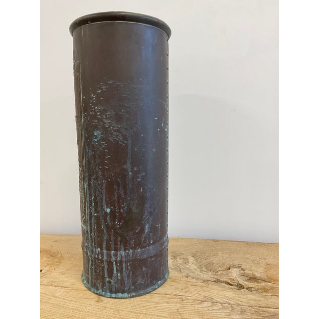 What a unique reuse opportunity, turning this antique fire extinguisher canister into the most interesting umbrella stand...