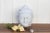 This contemporary Buddha is hand-carved from pure white marble and shows beautifully carved facial features. This stunning...