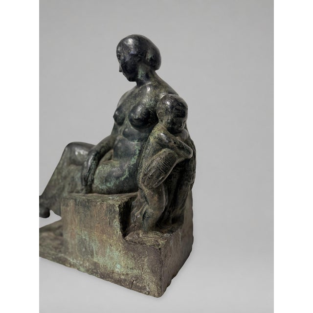 A fine French Art Deco patinated bronze sculpture by Henry-Ernest Parayre (French, 1883-1970), depicting a seated mother...