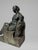 A fine French Art Deco patinated bronze sculpture by Henry-Ernest Parayre (French, 1883-1970), depicting a seated mother...