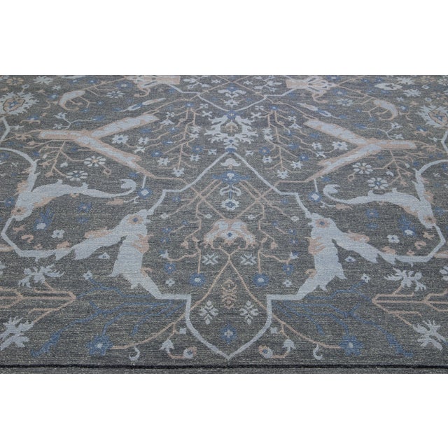 Beautiful Modern Soumak hand knotted wool rug with a gray field. This piece has accents in a gorgeous all-over geometric...