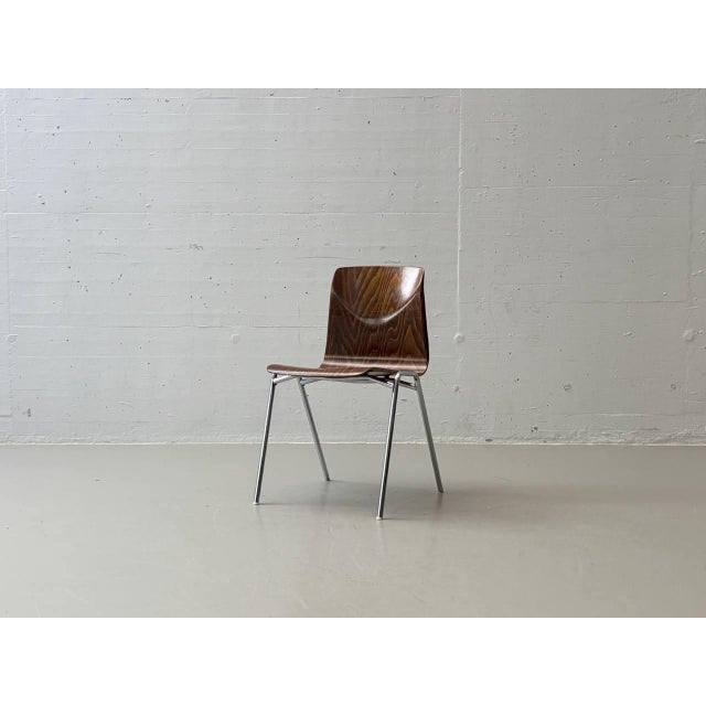 These distinctive stacking chairs combine functional industrial design with the warm appeal of high-quality molded...