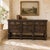 Antique French Renaissance Raised Buffet in Carved Oak makes a powerful statement with its impressive scale, deep relief...