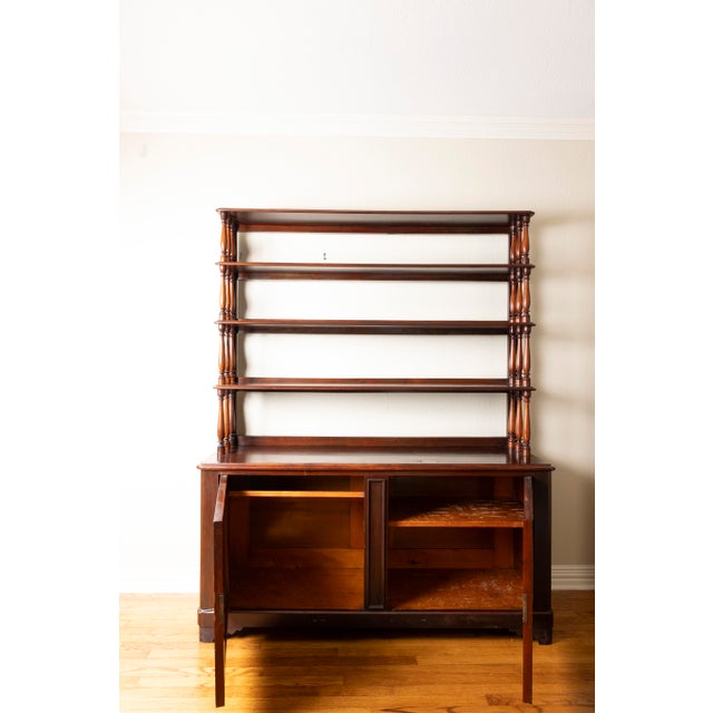 This antique Antique British Colonial Server With Cabinet is a versatile and elegant piece that adds character to any...