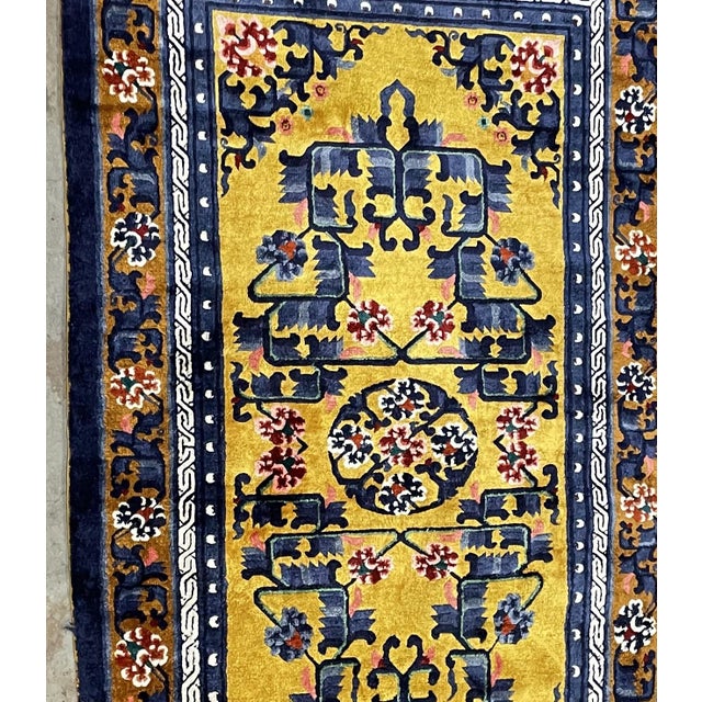 A striking handmade vintage Chinese Art Deco silk rug from the 1950s, distinguished by its luminous golden-yellow field...