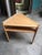 An extraordinary studio-crafted triangular side table, showcasing exceptional craftsmanship and thoughtful design. With...