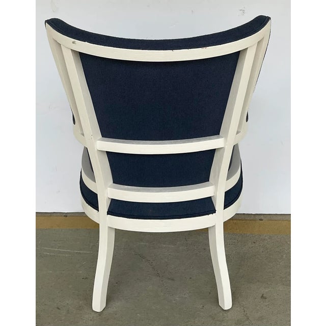 Stylish Modern Blue and White Wingback Chair, white wood frame, dark blue fabric, showroom floor sample