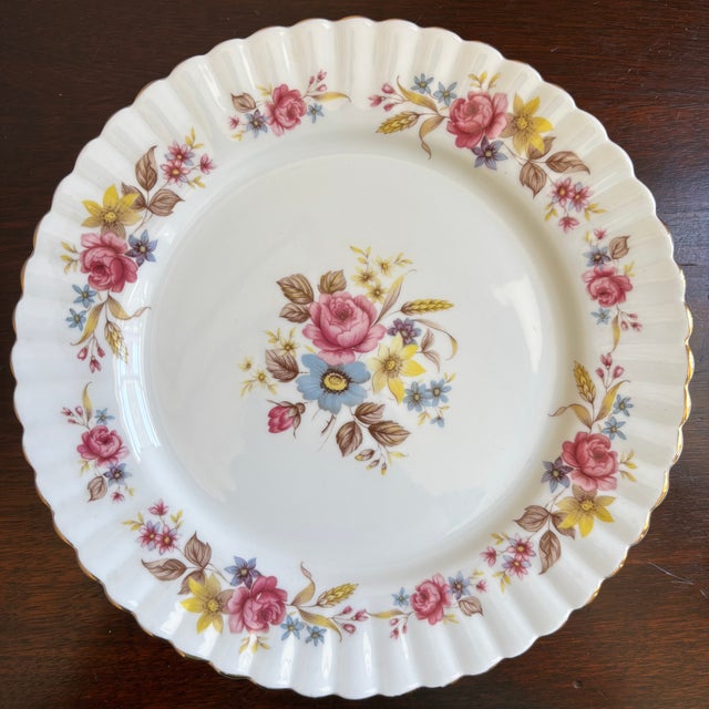 Offering a lovely vintage fine bone china decorative dessert plate made in England. This charming plate features romantic...