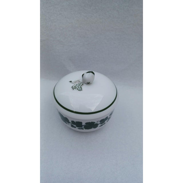 An exquisite and finely crafted porcelain sugar bowl with a matching lid from the world-renowned Meissen Porcelain...