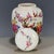 This is a charming vintage Chinese porcelain tea jar, decorated in the famille rosepalette with vibrant polychrome...