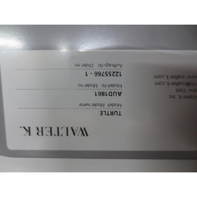 The Walter Knoll Turtle Chair, designed by Pearson Lloyd, is a modern interpretation of the classic shell chair. It...