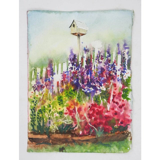 Small late 20th century watercolor on paper painting of colorful backyard garden with birdhouse and red and purple...