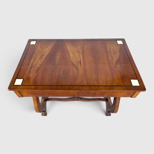An English mid 19th century figured walnut Side Table / Ladies Desk. Lyre shape side supports. Ebony-inlaid striping and...