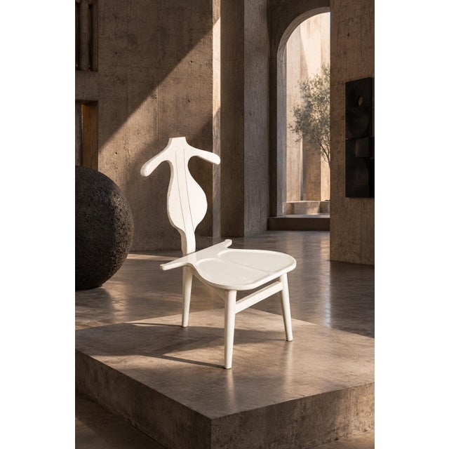 A sculptural valet chair based on hans j. Wegner's celebrated "valet chair" model, originally designed in 1953. the piece...