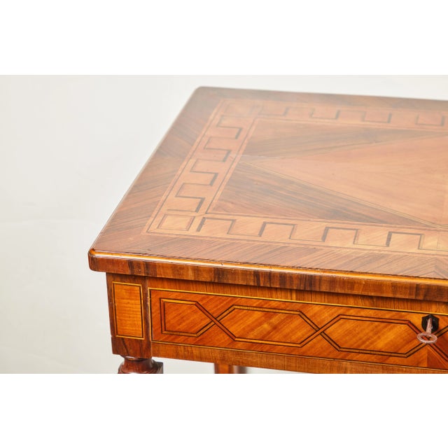 A beautifully hand-carved and inlaid, c. 1825, Italian, single drawer, tapered leg writing desk with extended tablets on...