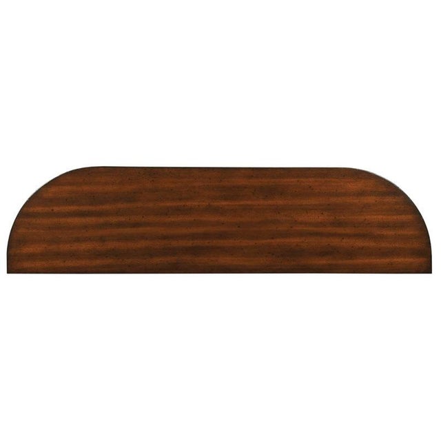 A wonderful table with sophisticated metropolitan styling. A shaped mahogany veneered top is placed over an apron rail...