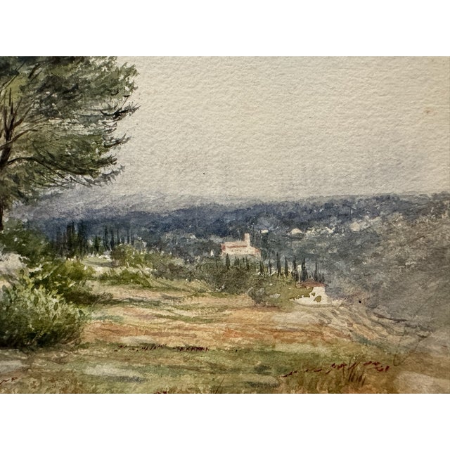 Original watercolor on textured paper depicting a broad country landscape with mature trees, open fields, shrubs and a...