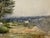 Original watercolor on textured paper depicting a broad country landscape with mature trees, open fields, shrubs and a...