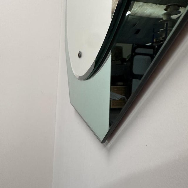 Width: 69 centimeters Height: 69 centimeters Elegant Italian wall mirror from the 1970s, featuring a refined octagonal...