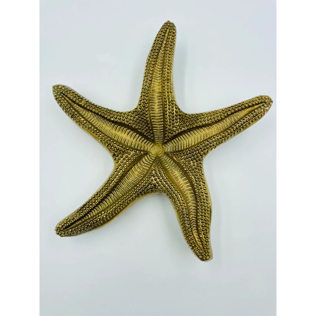 This fantastic brass starfish sculpture is so realistically detailed from the top to bottom that it must have been modeled...