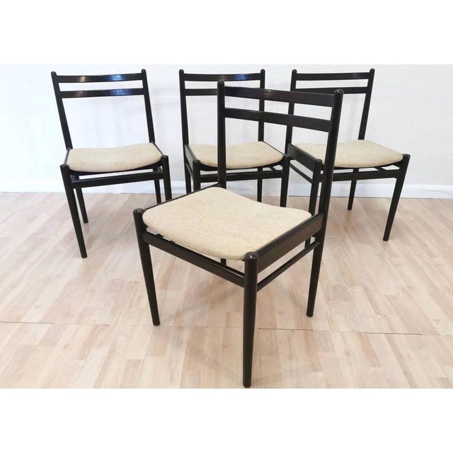 Set of four vintage dining chairs by Stol Kamnik, produced in Yugoslavia in the 1970s. The chairs feature a clean, minimal...