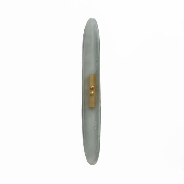 Wall light composed of an organic element in curved, aqua green, satin-finish Murano glass in the shape of a leaf, in the...