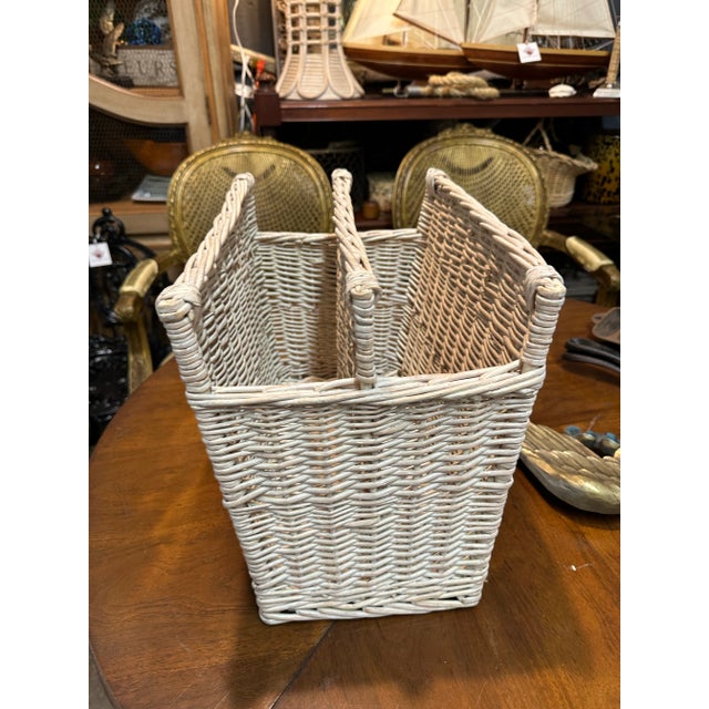 Vintage white washed natural wicker divided magazine holder.