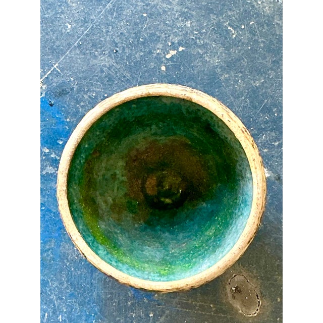 This striking original studio pottery bowl is a visceral exploration of texture and contrast, embodying the raw energy of...