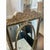 Offered is a vintage Hollywood regency style mirror with beveled glass. This black and gold gilt mirror offers a timeless...
