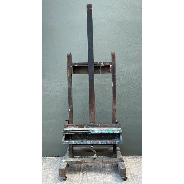 This vintage rustic wood artist easel captures the authentic character of a well-loved studio essential, its robust wood...