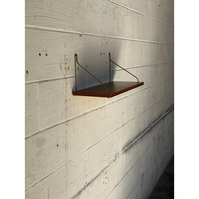 Vintage Teak Floating Wall Shelf With Brass-Tone Metal Brackets – Mid-Century Modern Scandinavian Wall-Mounted Shelf For Sale - Image 9 of 10