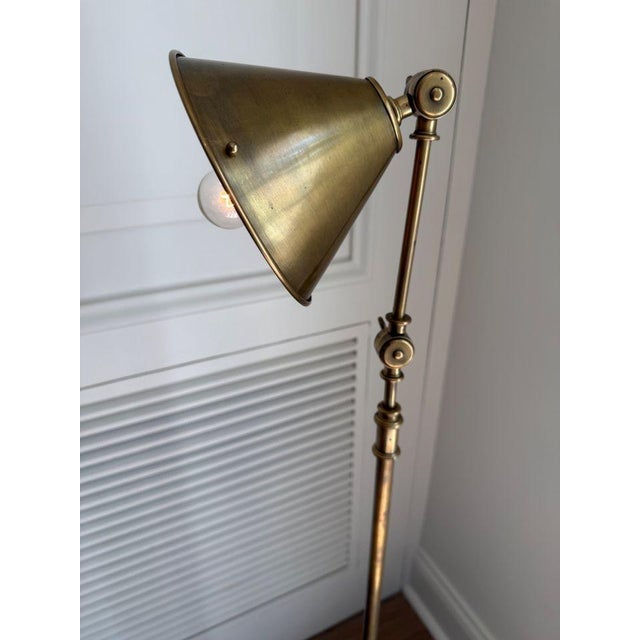 Classically designed floor lamp in natural brass finish. The lamp has two working screws which allow for light to be...