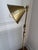 Classically designed floor lamp in natural brass finish. The lamp has two working screws which allow for light to be...