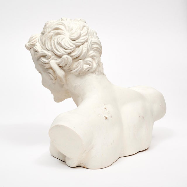 Plaster bust from the Art Deco period in France. This piece shows a faun with pointed ears and whimsical facial expression...