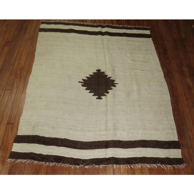 A one of a kind hand-woven mid 20th century Turkish Mohair Rug in white and brown. The piece can be used as a throw too on...