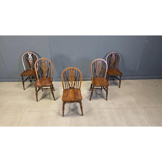 Set of 5 spindle back Ercol dining chairs. The chairs are beautifully crafted with an eye for details and are made of...