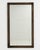 A circa 1900 French wall mirror designed in the Louis Philippe style, characterized by its simple form and gently rounded...