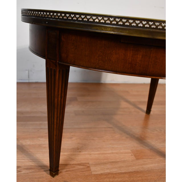 We are pleased to offer this beautiful Antique French Louis XVI coffee table, from the 1930s. This Table is made of walnut...