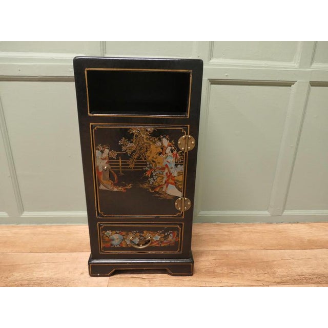 Lucky Decorated Chinoiserie Side Cupboard The cupboard is in black lacquer and skilfully painted with characters and...