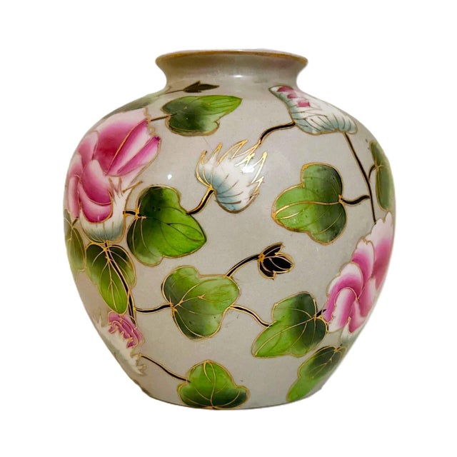 Elegant round ceramic vase featuring a continuous hand-painted motif of large, rounded peonies with gilded accents. Set...