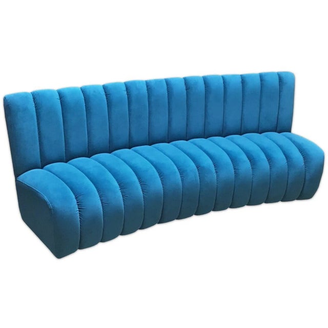 Lounge in Art Deco Luxe: The Channeled Curved Banquette This isn't just a banquette; it's a statement piece. The Channeled...