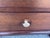 Pair of Three Drawer Brown Finished Wood Nightstands. Each nightstand has three drawers with silver tone pulls. All the...