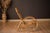 Mid century modern rocker in the style of Franco Albini, circa 1970's. Features woven rattan details and a tall supporting...